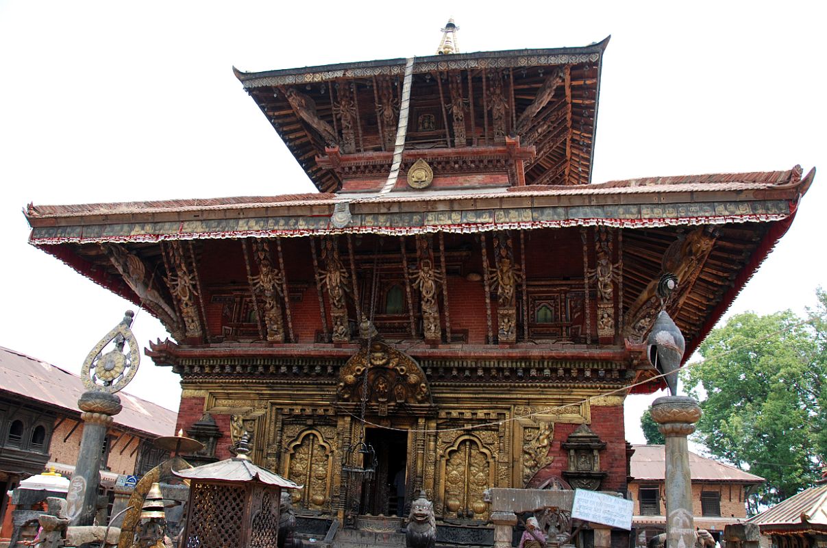 Kathmandu Changu Narayan 16 Changu Narayan Temple Main Entrance The main entrance to the Changu Narayan Temple is on the west side with two of the traditional symbols of Vishnu on the pillars to the left and right  the chakra wheel and conch shell.